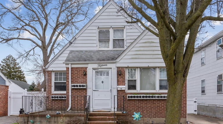 Listed for $549,000, this four-bedroom, two-bathroom Cape in Rockville Centre features...