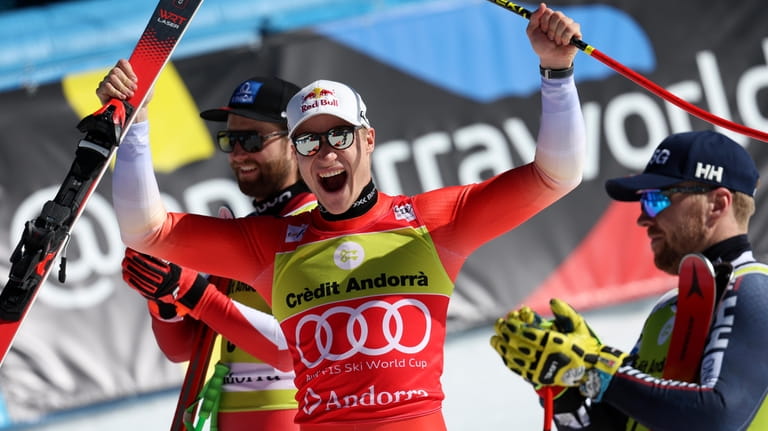 Switzerland's Marco Odermatt, center, winner of an alpine ski, men's...