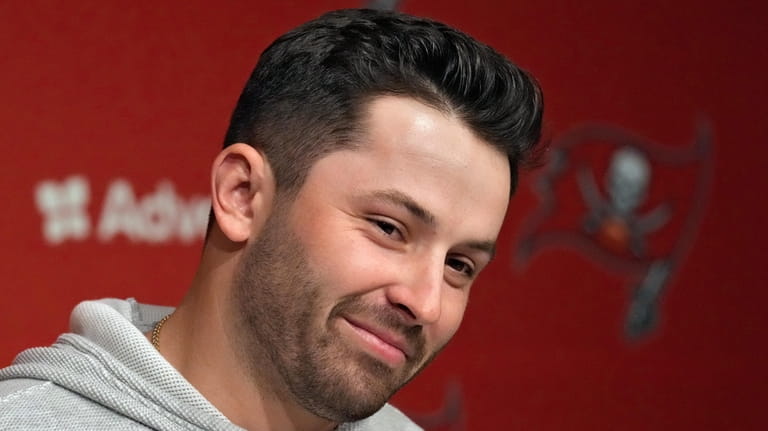 New Tampa Bay Buccaneers quarterback Baker Mayfield smiles as he...