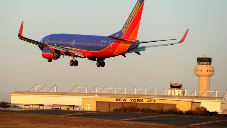 A Southwest Airline 737 plane landing at MacArthur Airport in...