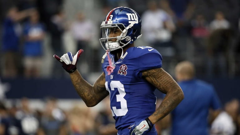 Giants wide receiver Odell Beckham gestures as he jogs up...