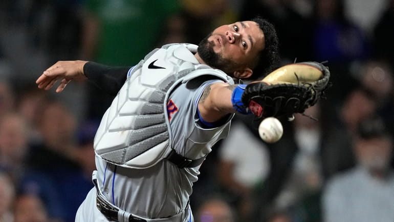 Mets catcher Gary Sanchez is unable to catch a popup...