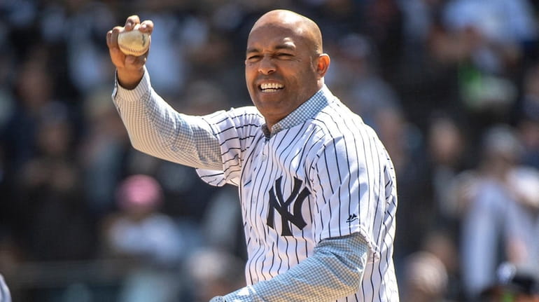 Former Yankees pitcher Mariano Rivera throws out the first pitch before...