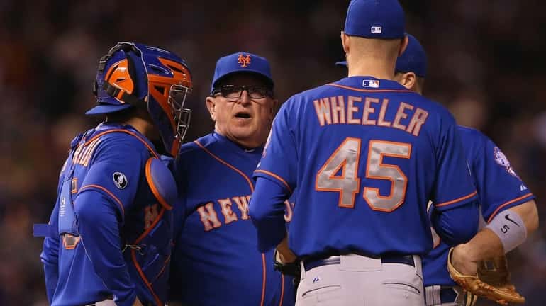 Pitching coach Dan Warthen of the Mets visits the mound...