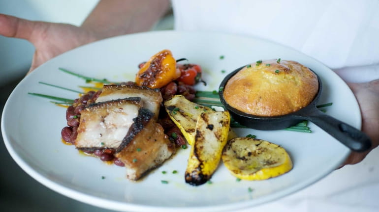 Smoked pork belly served with a bourbon-maple bean ragout, squash...