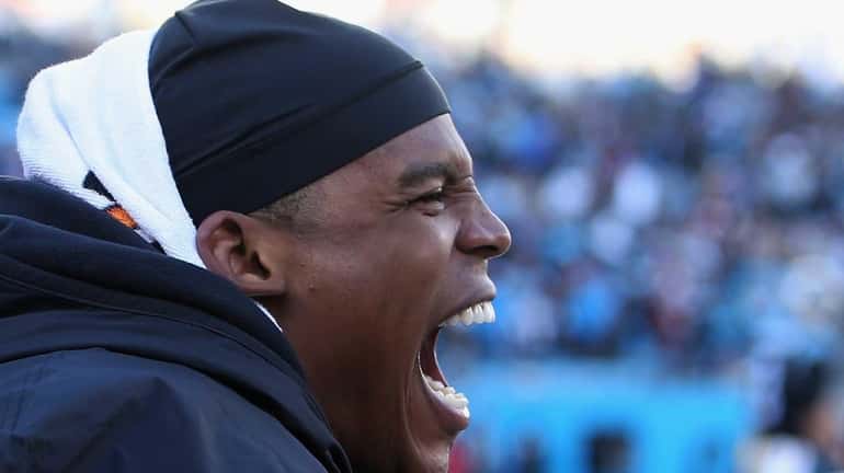 Cam Newton of the Carolina Panthers celebrates after defeating the...