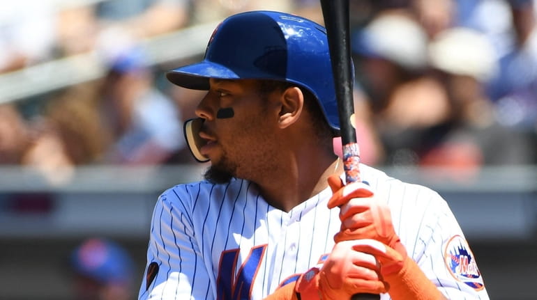 Mets leftfielder Dominic Smith waits for a pitch during the second...