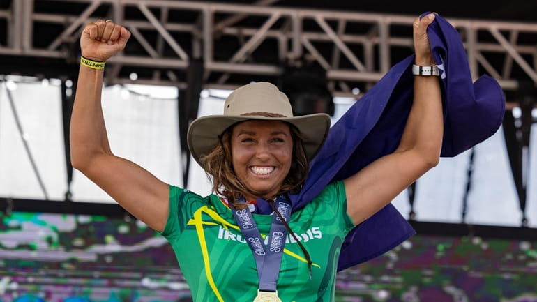 Sally Fitzgibbons of Australia, celebrates winning the gold medal at...