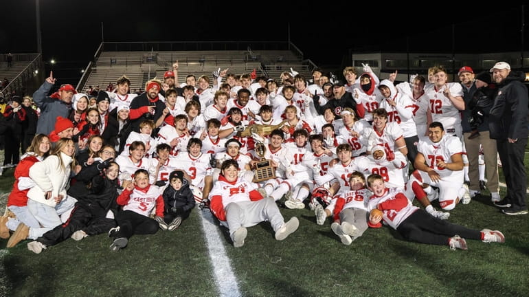 East Islip poses with the Long Island Class III championship trophy...