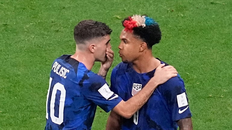 Christian Pulisic of the United States, left, speaks with teammate...