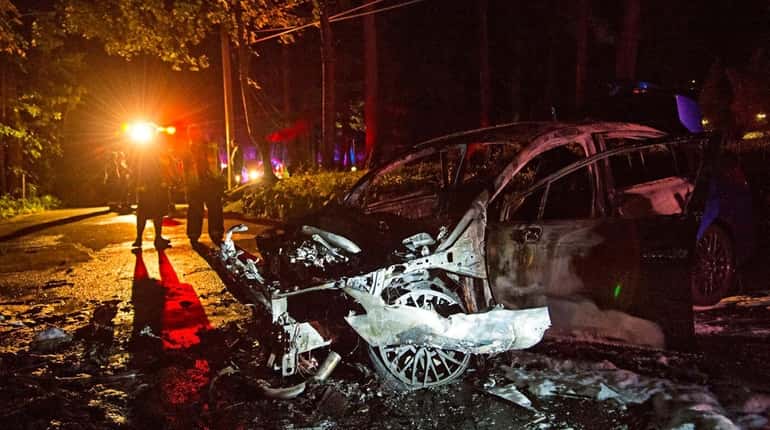 Officials said a car caught fire after it struck a...