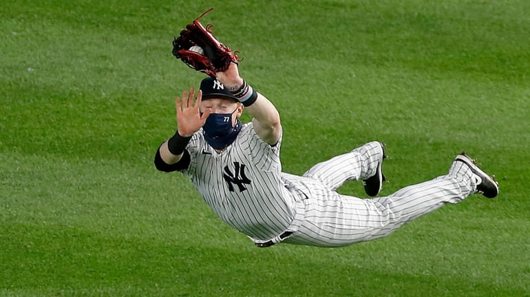 Clint Frazier of the New York Yankees makes a diving...