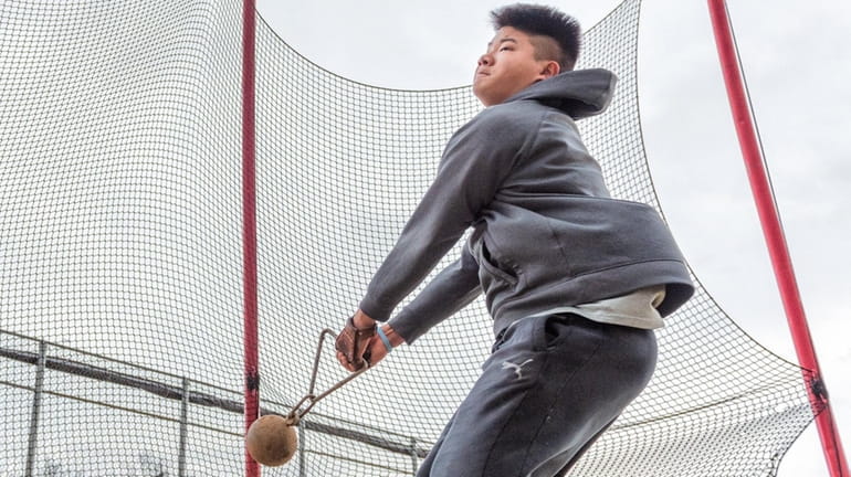 Parker Kim of Syosset practices his technique in the weight...