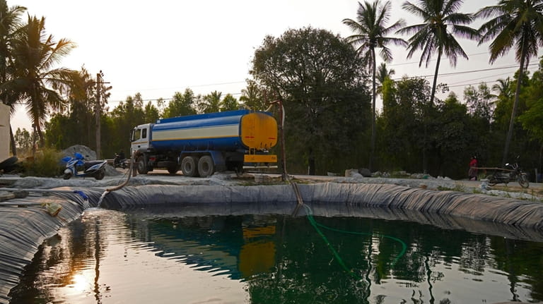 Potable water is loaded into a private water tanker from...