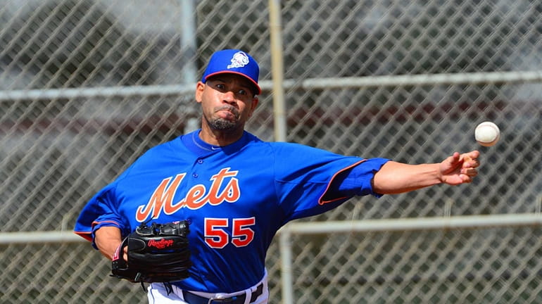 Mets pitcher Pedro Feliciano throws a bullpen session during a...