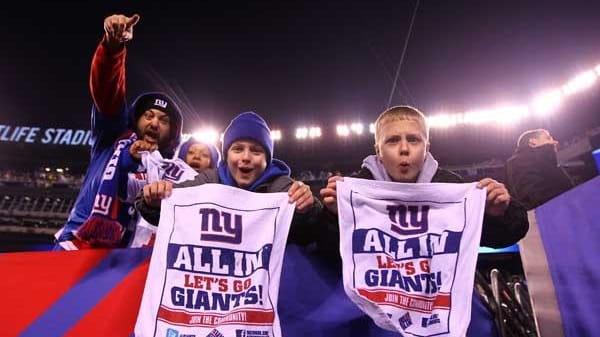 Fans celebrate after the New York Giants defeated the Dallas...