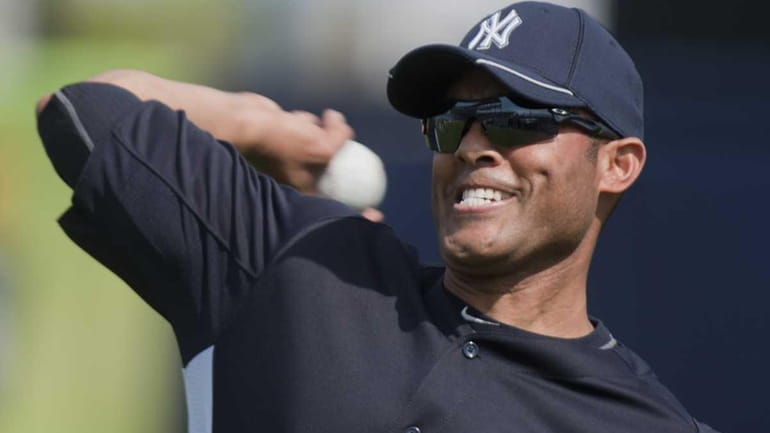 Yankees' pitcher Mariano Rivera warming up his arm during a...