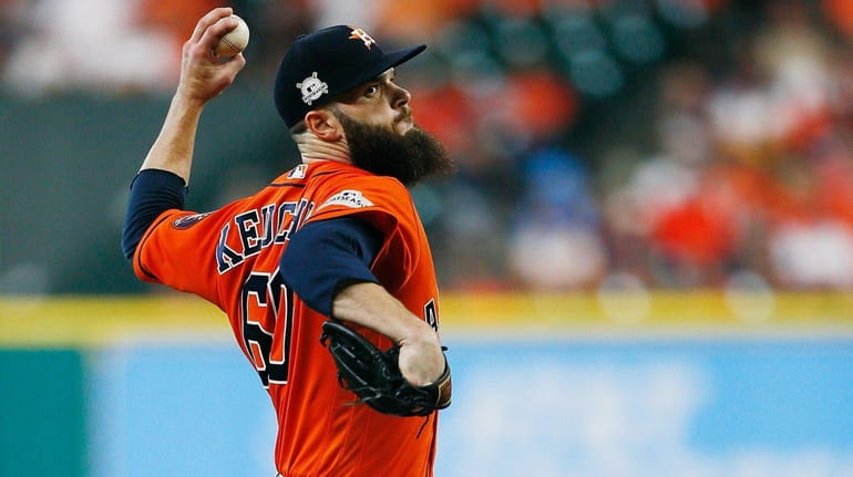 Dallas Keuchel of the Astros throws a pitch in the...