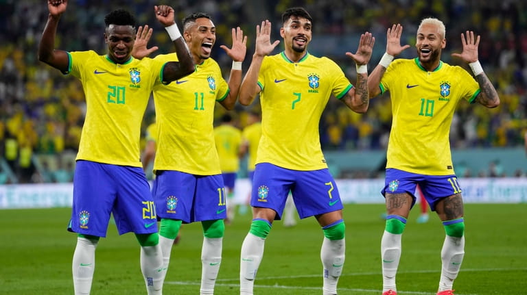Brazil's Neymar, from right, celebrates with team mates Lucas Paqueta,...