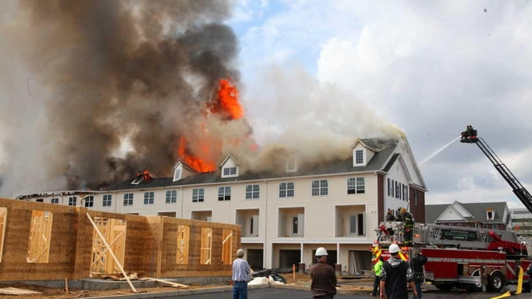 Firefighters battle a fire which broke out at the new...