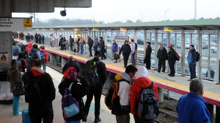 LIRR commuters await a train at the Ronkonkoma station on...