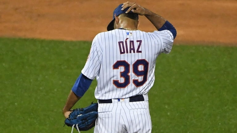 Mets relief pitcher Edwin Diaz stands on the mound after...
