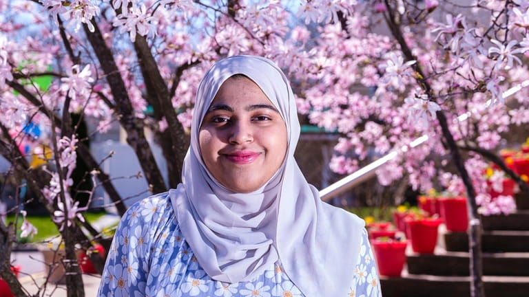 Sania Daniyal, 16, wears the hijab at the Islamic Center...