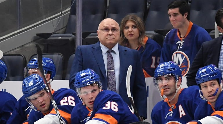 New York Islanders Barry Trotz looks on in the first...