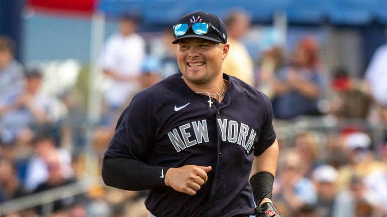 New York Yankees' 1st baseman Luke Voit leaving the field...