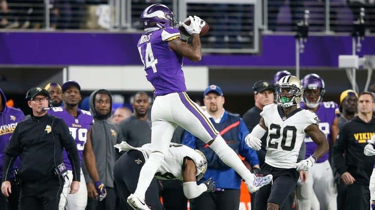 Stefon Diggs of the Minnesota Vikings makes a catch over...