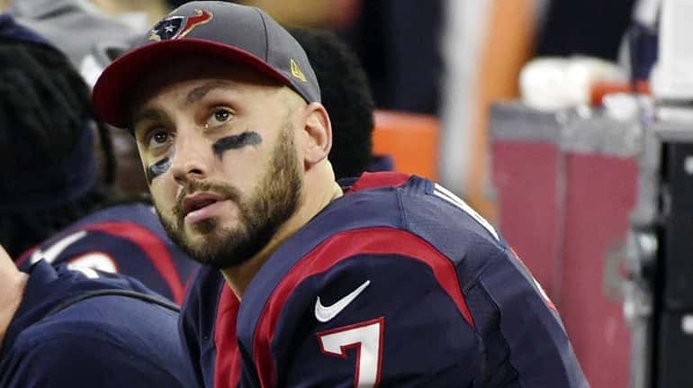 Houston Texans quarterback Brian Hoyer sits on the bench during...