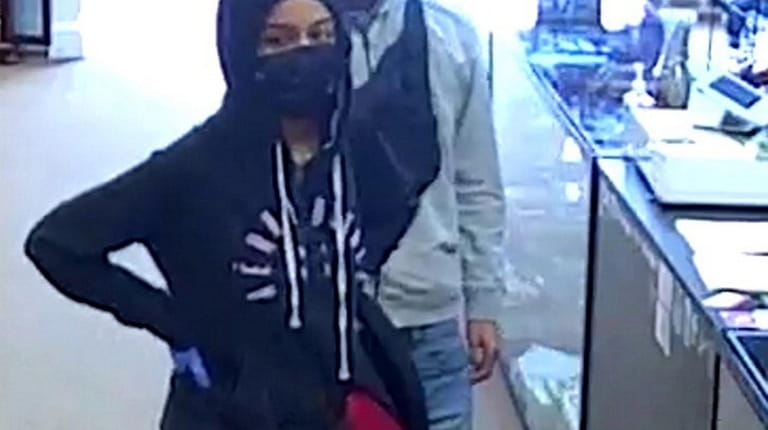 Photo released by police of two people sought in connection...