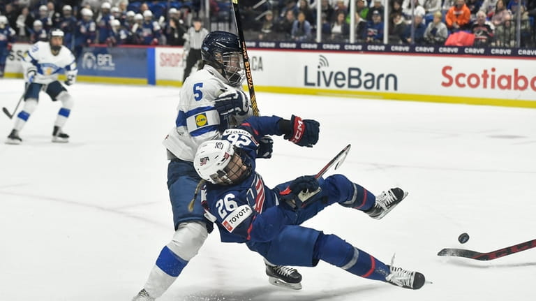United States forward Kendall Coyne Schofield (26) is tripped by...