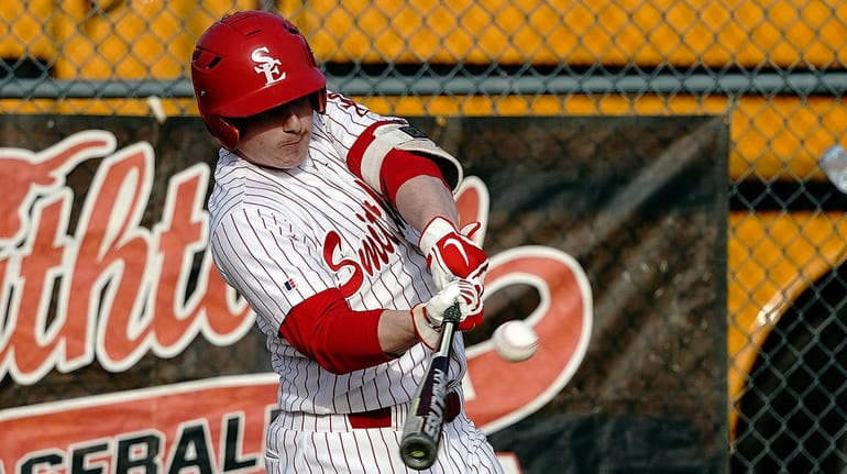 Smithtown East's Ryan Pennisi (8) strokes a solo homer to...