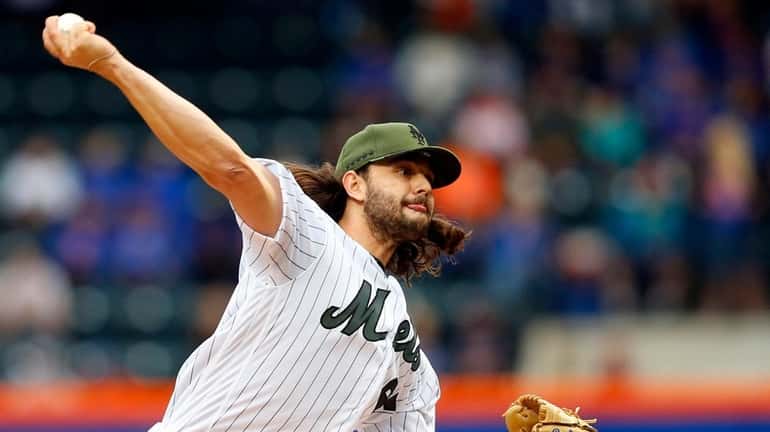Robert Gsellman of the Mets pitches in the first inning...