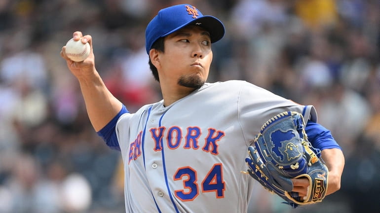 Kodai Senga #34 of the Mets pitches in the second inning...