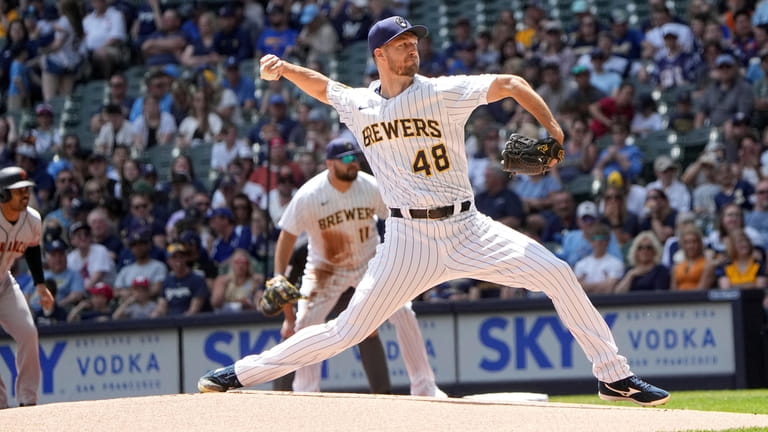 Milwaukee Brewers starting pitcher Colin Rea (48) throws during the...