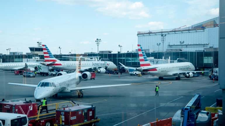 Airplanes sit on the tarmac at Laguardia Airport Terminal B...