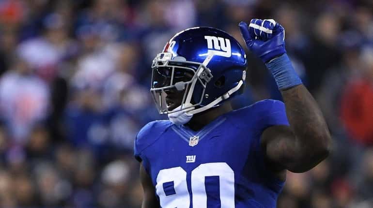 New York Giants defensive end Jason Pierre-Paul reacts against the...
