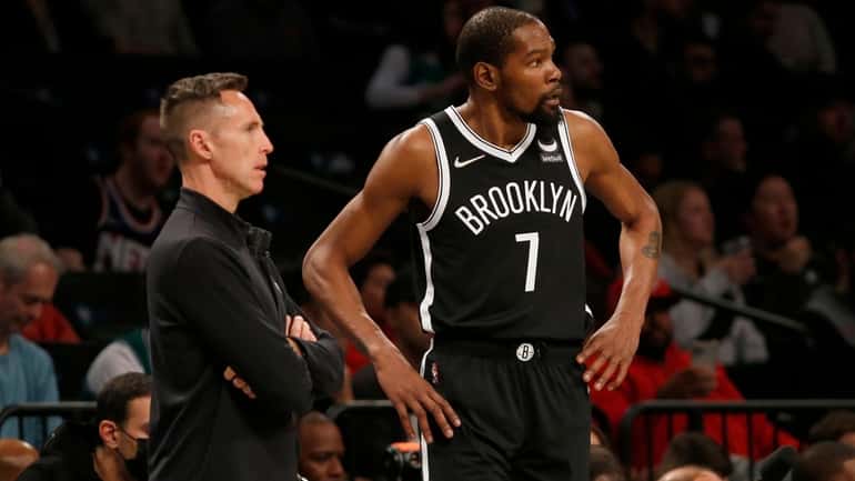 Kevin Durant of the Brooklyn Nets and head coach Steve Nash at...