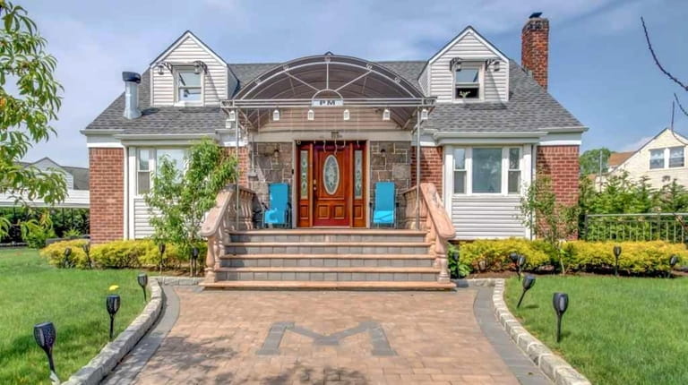 Priced at $1,450,000, this six-bedroom, four-bathroom Cape sits on a...