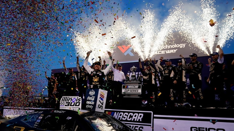 Kyle Busch celebrates after winning a NASCAR Cup Series auto...