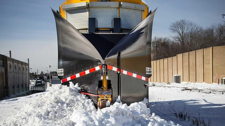 A train with a snow remover at the Ronkonkoma LIRR...