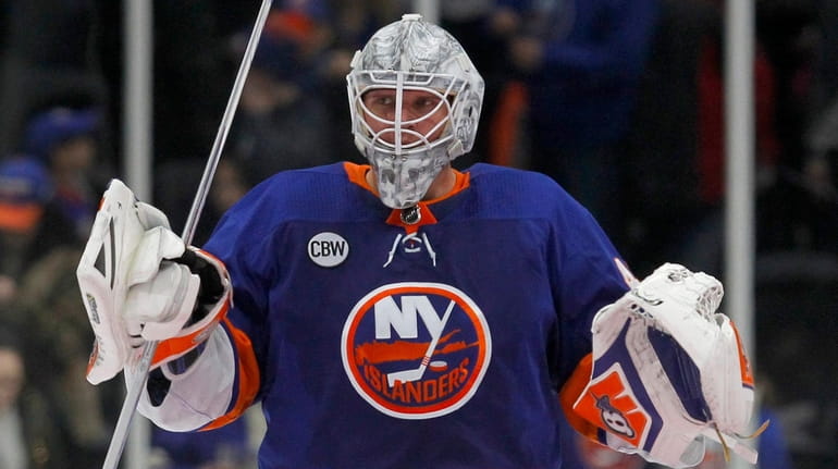 Islanders goalie Robin Lehner celebrates after defeating the Coyotes at NYCB...