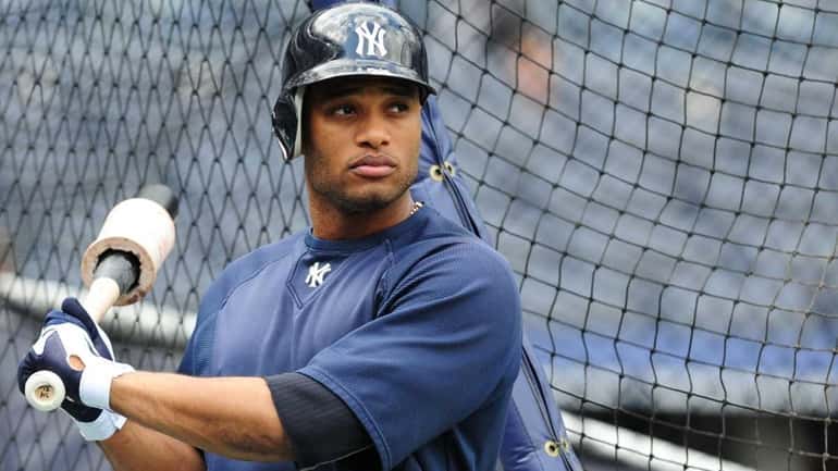 Robinson Cano takes batting practice during a workout at Yankee...