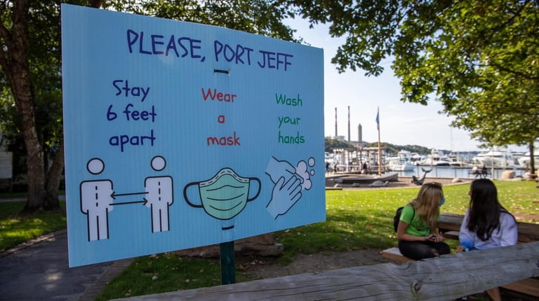 A sign encourages Port Jefferson residents to take measures to prevent...