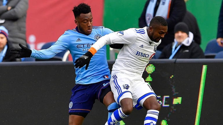 NYC FC's Rodney Wallace pursues Montreal's Chris Duvall during Saturday's...