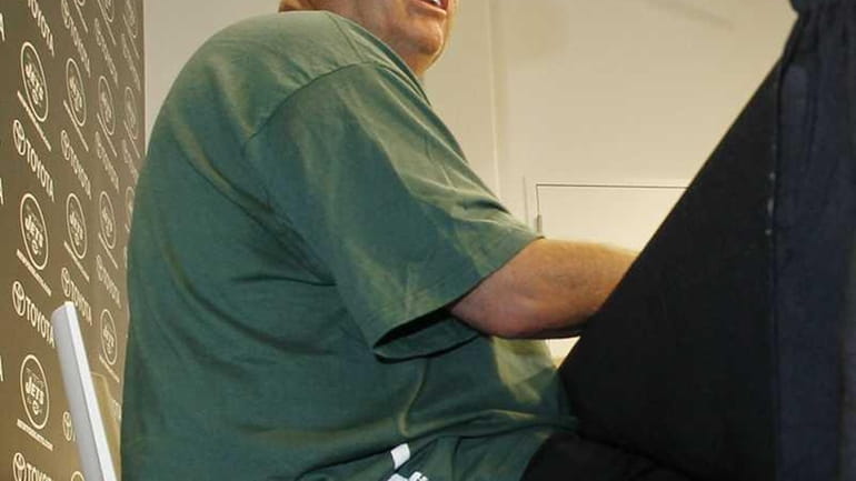 The tattooed right leg of New York Jets head coach...