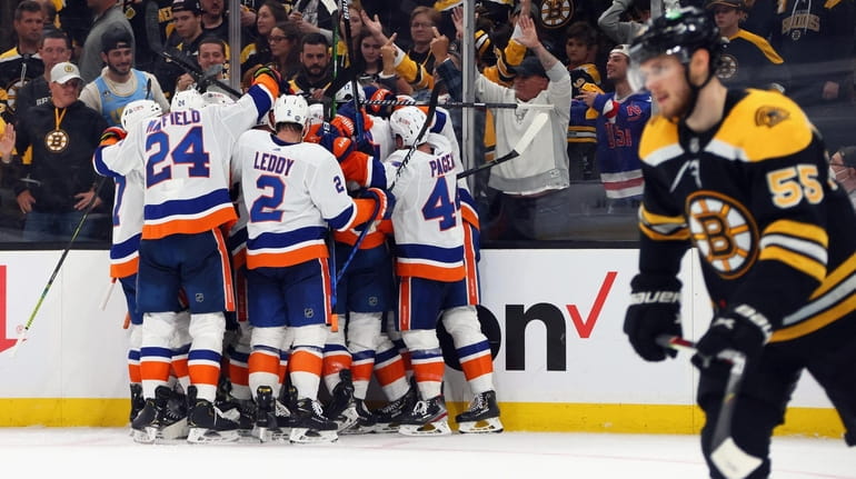 Casey Cizikas #53 and the New York Islanders celebrate his...