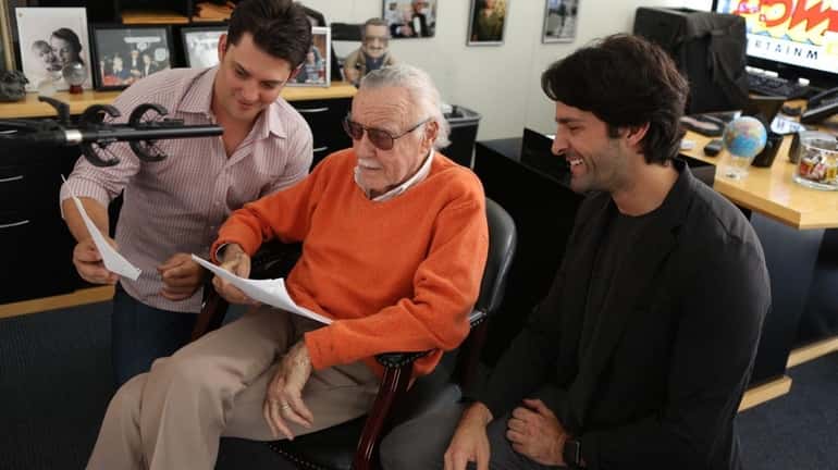 Marvel Comics icon Stan Lee, center, with Luke Lieberman, left,...